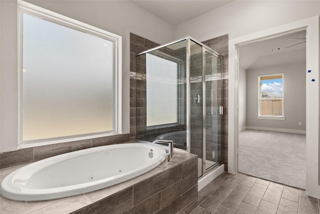 bathroom with separate shower and tub