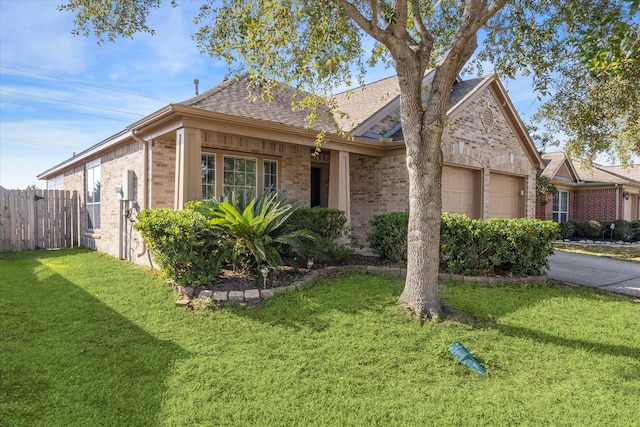 ranch-style house with a garage and a front lawn