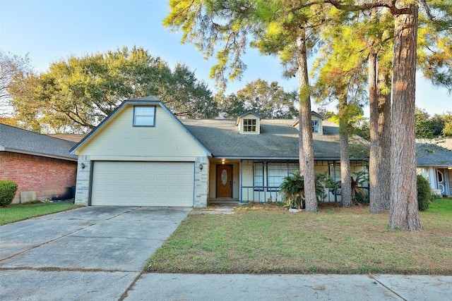 view of front of house featuring brick siding, concrete driveway, a front yard, covered porch, and an attached garage