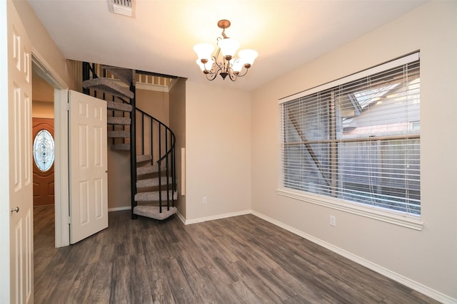 9130 Kirkleigh St, Spring, TX 77379 - spare room with a chandelier, dark wood-style flooring, baseboards, and stairway