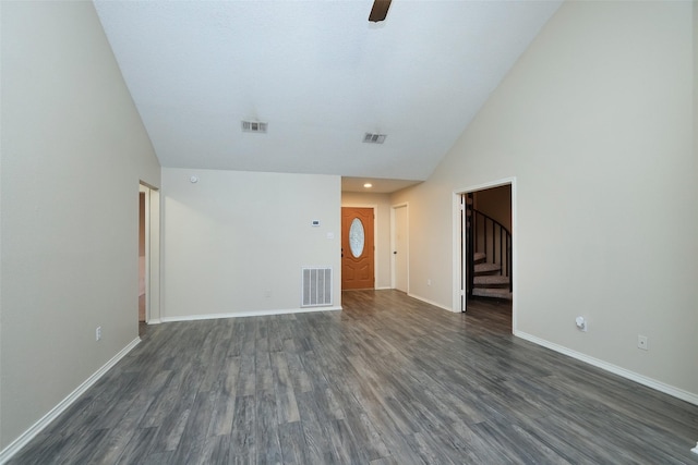 unfurnished living room with high vaulted ceiling, dark hardwood / wood-style floors, and ceiling fan