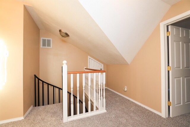 bonus room featuring lofted ceiling and carpet floors