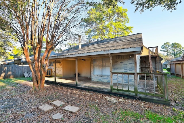 9130 Kirkleigh St, Spring, TX 77379 - back of property with a deck and ceiling fan