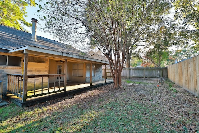 9130 Kirkleigh St, Spring, TX 77379 - fenced backyard featuring a ceiling fan