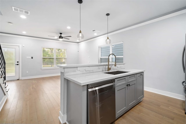 kitchen featuring gray cabinetry, ceiling fan, sink, stainless steel dishwasher, and ornamental molding