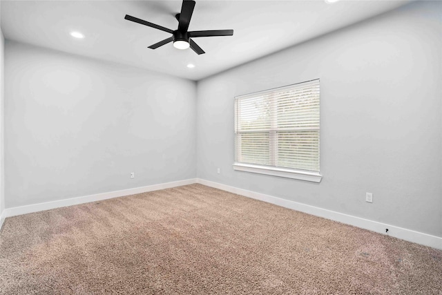 empty room featuring ceiling fan and carpet floors