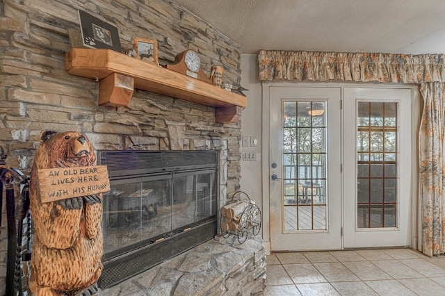 details featuring french doors, a fireplace, and a textured ceiling