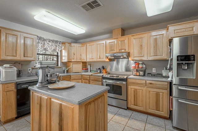 kitchen featuring a textured ceiling, a kitchen island, stainless steel appliances, and light brown cabinetry