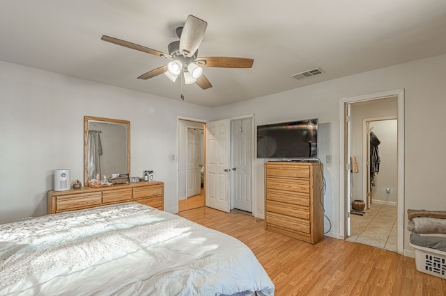 bedroom with ceiling fan and light wood-type flooring