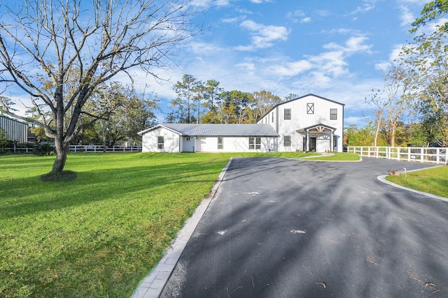 view of front facade featuring a garage and a front lawn