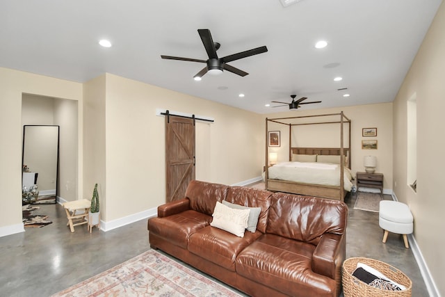 bedroom featuring a barn door and ceiling fan