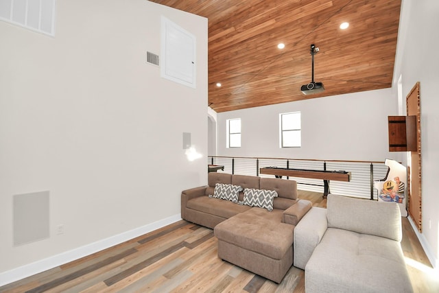 living room featuring light wood-type flooring, wood ceiling, and high vaulted ceiling