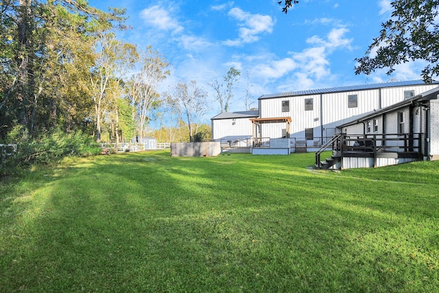 view of yard featuring a wooden deck