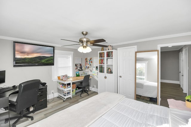 bedroom with ceiling fan, light wood-type flooring, and ornamental molding