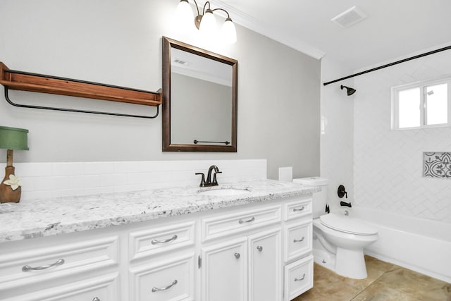 full bathroom with ornamental molding, vanity, tile patterned flooring, toilet, and tiled shower / bath