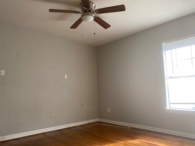 unfurnished room featuring light hardwood / wood-style flooring, ceiling fan, and a healthy amount of sunlight