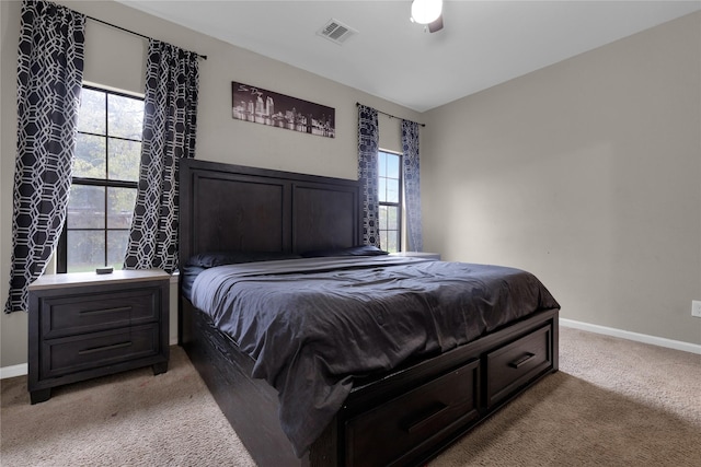 carpeted bedroom with ceiling fan