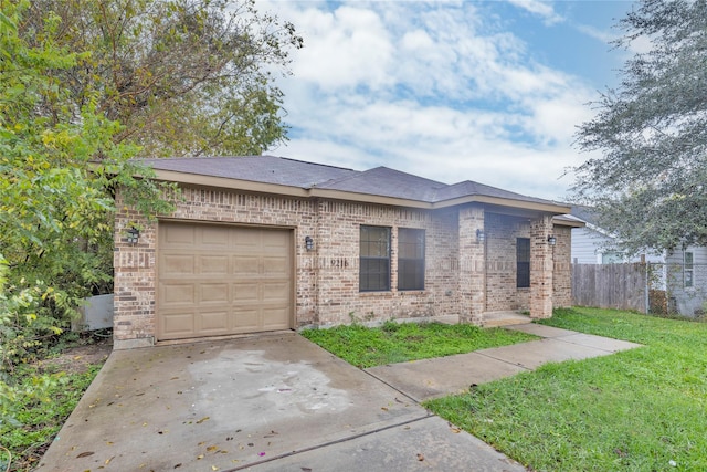 view of front of house with a garage and a front lawn