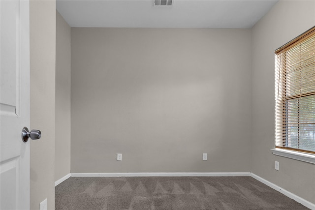 empty room featuring carpet floors