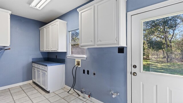 clothes washing area with hookup for an electric dryer, washer hookup, hookup for a gas dryer, and plenty of natural light