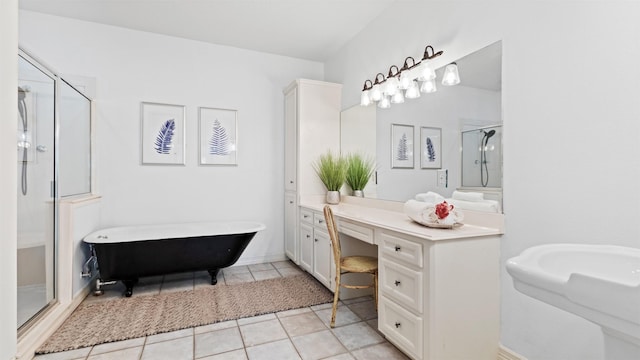 bathroom with tile patterned floors, vanity, and shower with separate bathtub