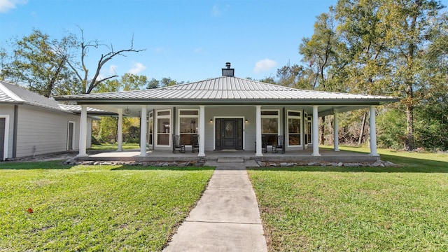 exterior space featuring a porch and a front lawn