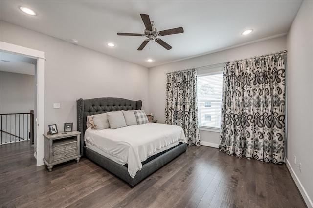 bedroom featuring ceiling fan and dark hardwood / wood-style flooring