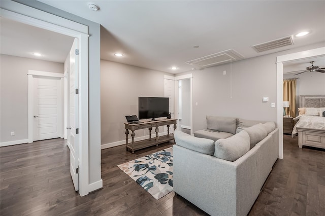 living room with ceiling fan and dark hardwood / wood-style flooring