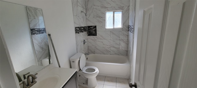 full bathroom featuring tile patterned flooring, vanity, tiled shower / bath combo, and toilet