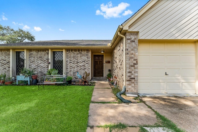 property entrance featuring a garage and a lawn