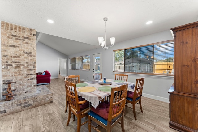 dining area with a chandelier, light hardwood / wood-style flooring, and plenty of natural light