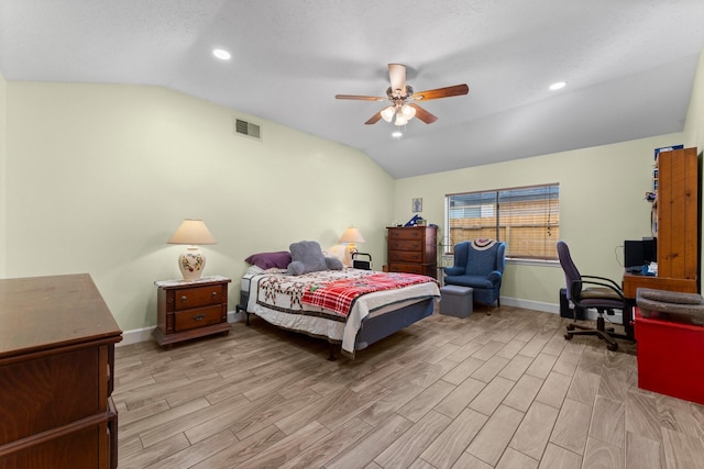 bedroom featuring ceiling fan, a textured ceiling, and vaulted ceiling