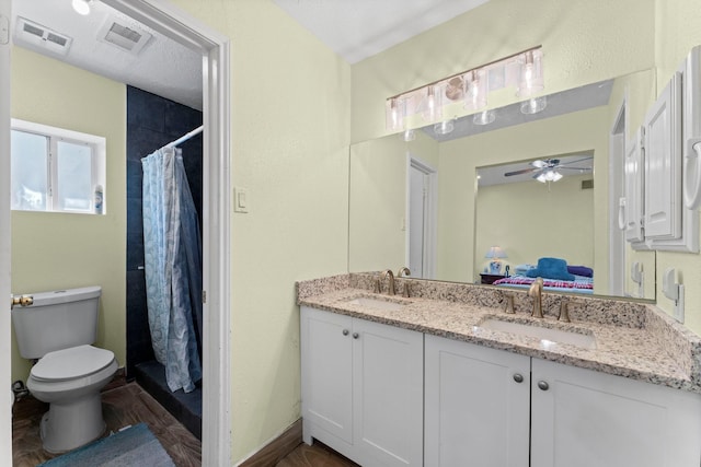 bathroom featuring ceiling fan, vanity, toilet, hardwood / wood-style floors, and a shower with shower curtain