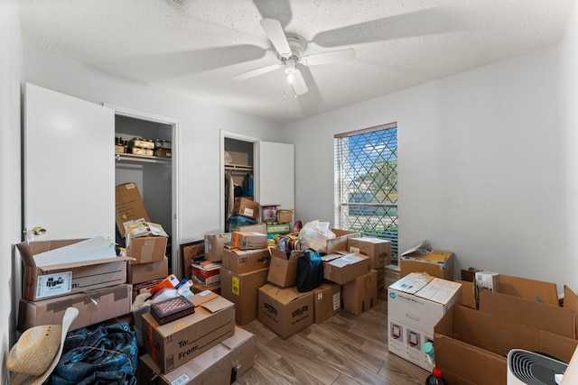 storage area featuring ceiling fan