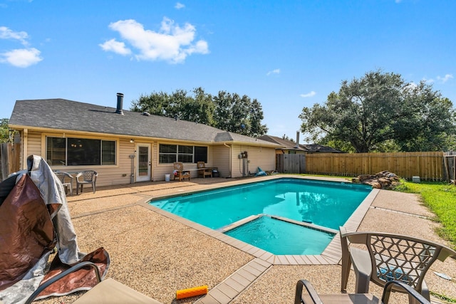 view of swimming pool with a patio area