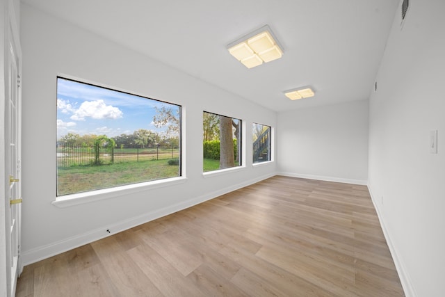 unfurnished room featuring light wood-type flooring