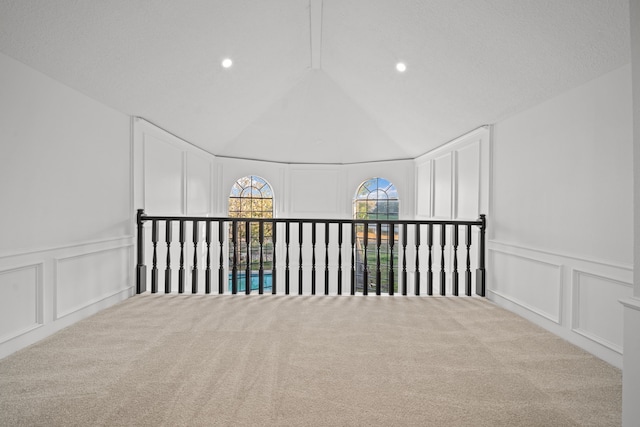 bonus room featuring light colored carpet and lofted ceiling