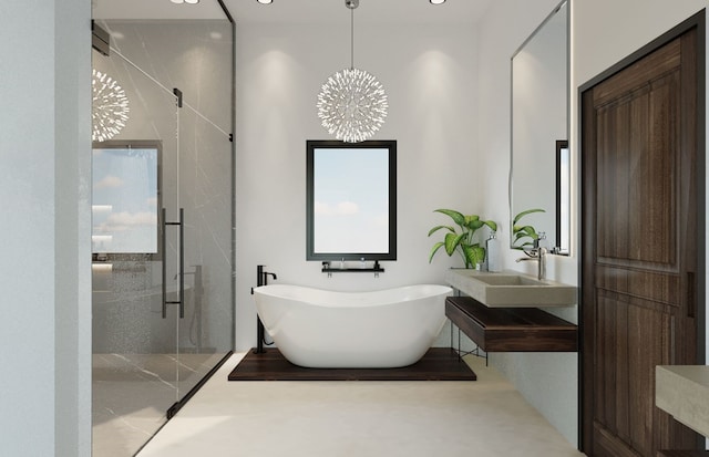 bathroom with plus walk in shower, an inviting chandelier, and sink