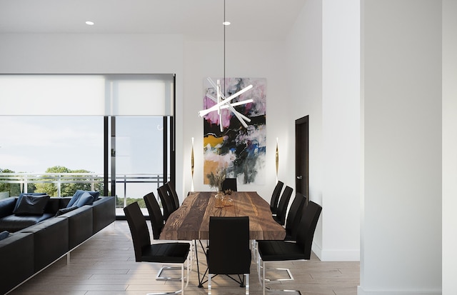 dining room with hardwood / wood-style flooring and a chandelier