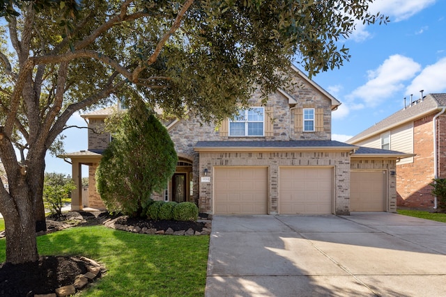 craftsman-style home with a garage and a front lawn