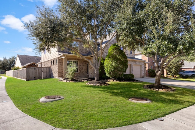 view of front of house with a front yard and a garage