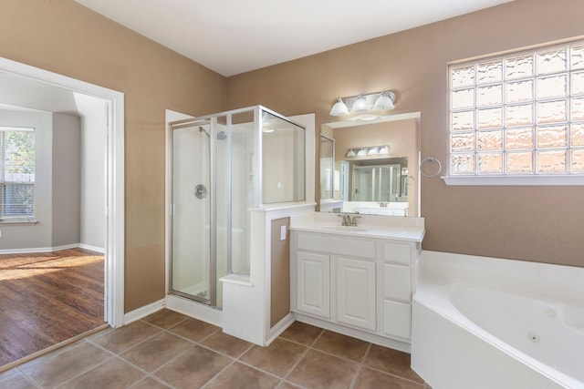 bathroom with vanity, tile patterned floors, and independent shower and bath