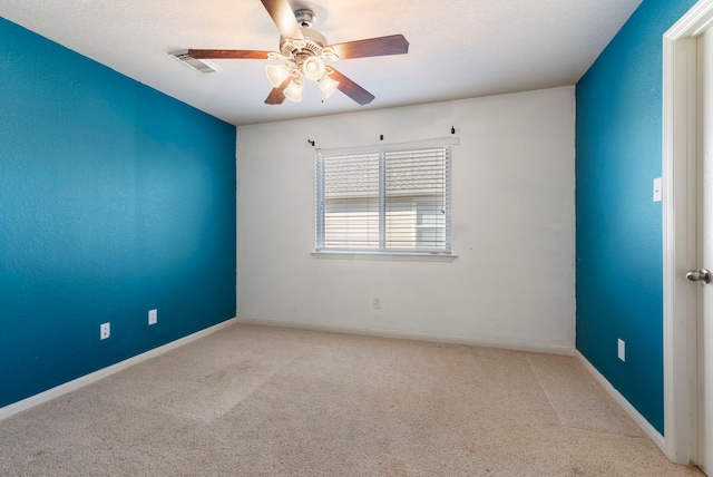 empty room with light carpet and ceiling fan