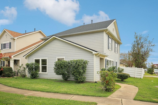 view of property exterior with a lawn