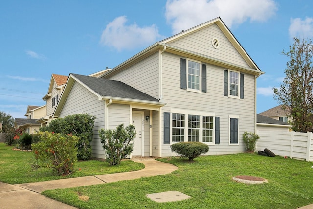 view of front of home with a front lawn