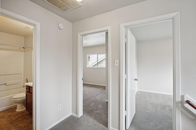 corridor with carpet floors