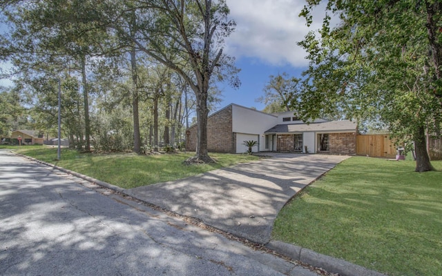 view of front facade with a front lawn and a garage