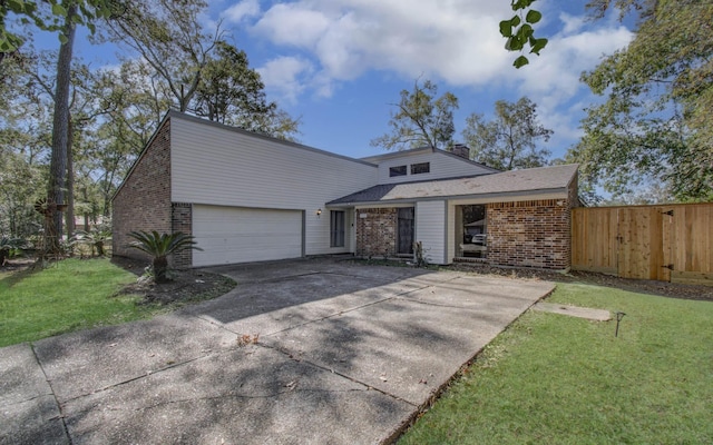 view of front of house featuring a front yard and a garage