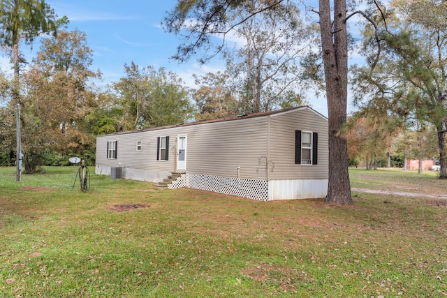 view of home's exterior featuring a yard