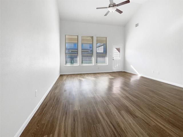 empty room featuring ceiling fan, dark hardwood / wood-style flooring, and high vaulted ceiling